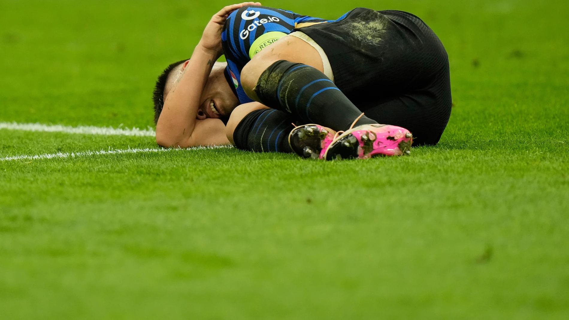 Inter Milan's Lautaro Martinez grimaces in pain after a tackle during the Champions League semifinal second leg soccer match between Inter Milan and Barcelona at San Siro stadium in Milan , Italy, Tuesday, May 6, 2025. (AP Photo/Luca Bruno)